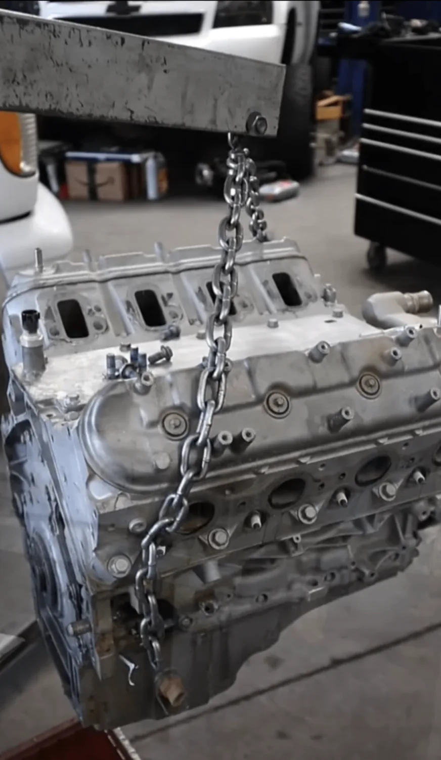 Engine block being hoisted in MJM Engines shop
